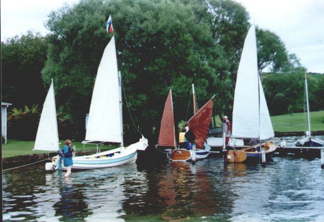 Three 15 foot home built Navigator sailing boats sailing in together