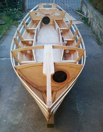 Wooden sailing boat Walkabout being built at home