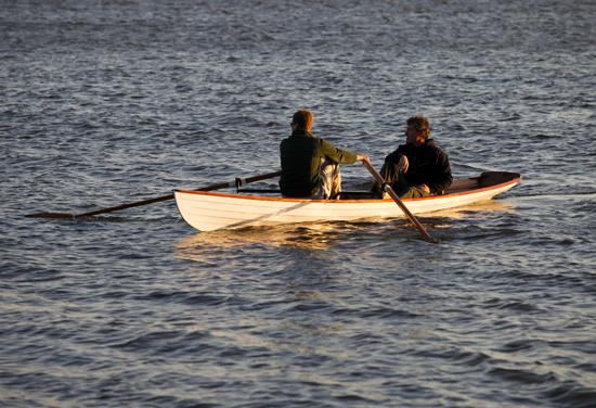 Wherry tandem rowing boat with a passenger