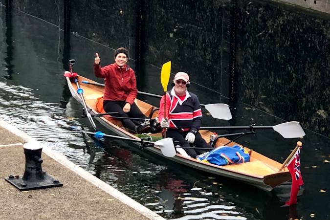 Tandem Wherry wooden rowing boat on the river Thames