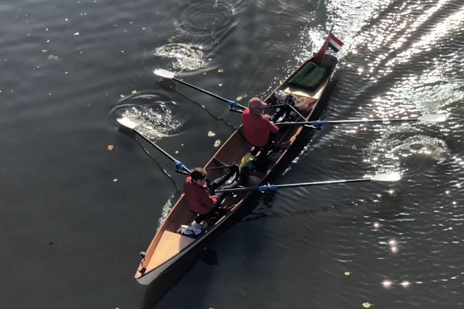 Tandem Wherry wooden rowing boat on the river Thames