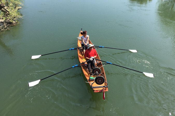 Tandem Wherry wooden rowing boat on the river Thames