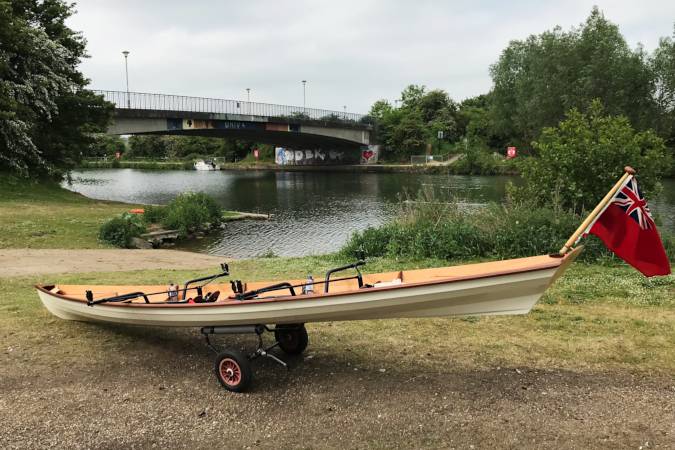 Tandem Wherry wooden rowing boat on the river Thames