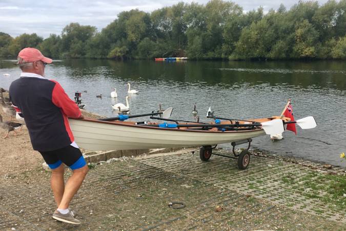 Tandem Wherry wooden rowing boat on the river Thames