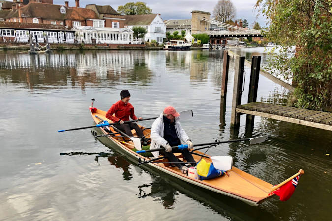 Tandem Wherry wooden rowing boat on the river Thames