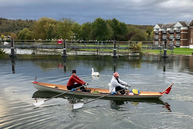 Tandem Wherry wooden rowing boat on the river Thames