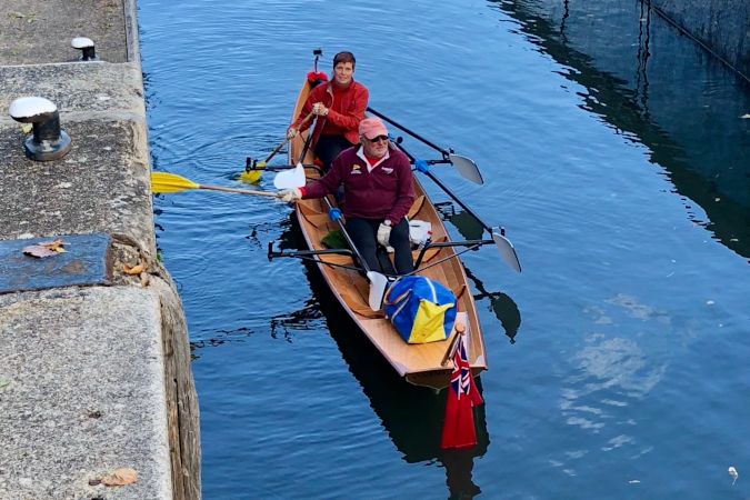 Tandem Wherry wooden rowing boat on the river Thames