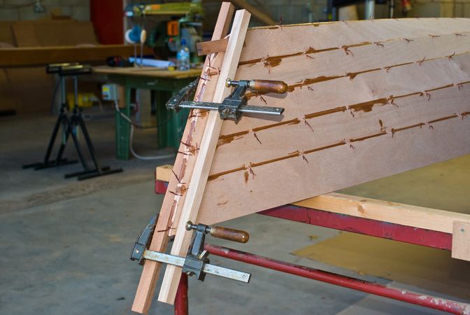 Straightening the bow on a Wherry rowing boat during the build