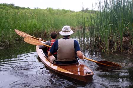 The Wood Duck Double is a compact tandem kayak built from a wooden kit