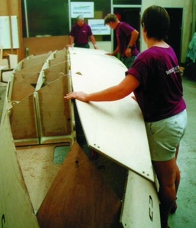 Building the Workstar motorboat uses a slot-together system of tabs, slots and wedges